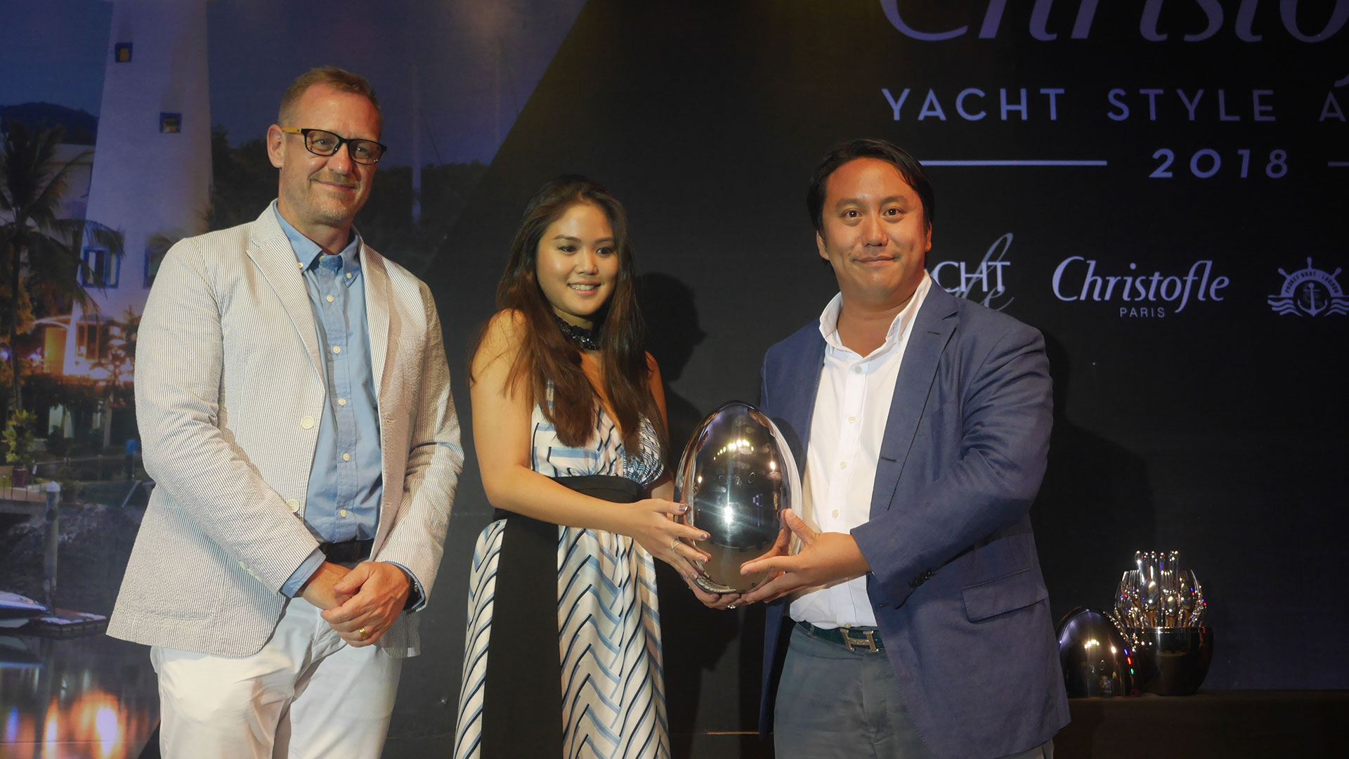 Mr. Vrit Yongsakul, Group Managing Director, Boat Lagoon Yachting, receives Entrepreneur of the Year award, together with Ms. Dhiprudee Yongsakul and Mr. Rico Stapel, Head of Charter, Boat Lagoon Yachting
