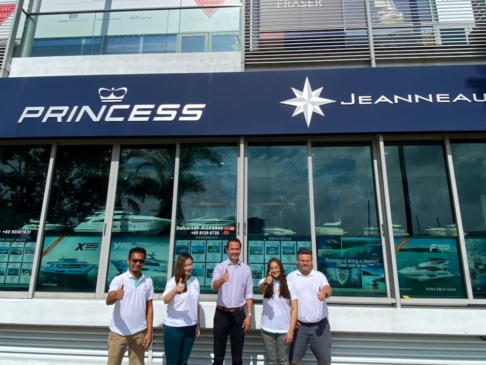 Mr. Alister Brunskill (centre) and our Princess Yachts Team.
